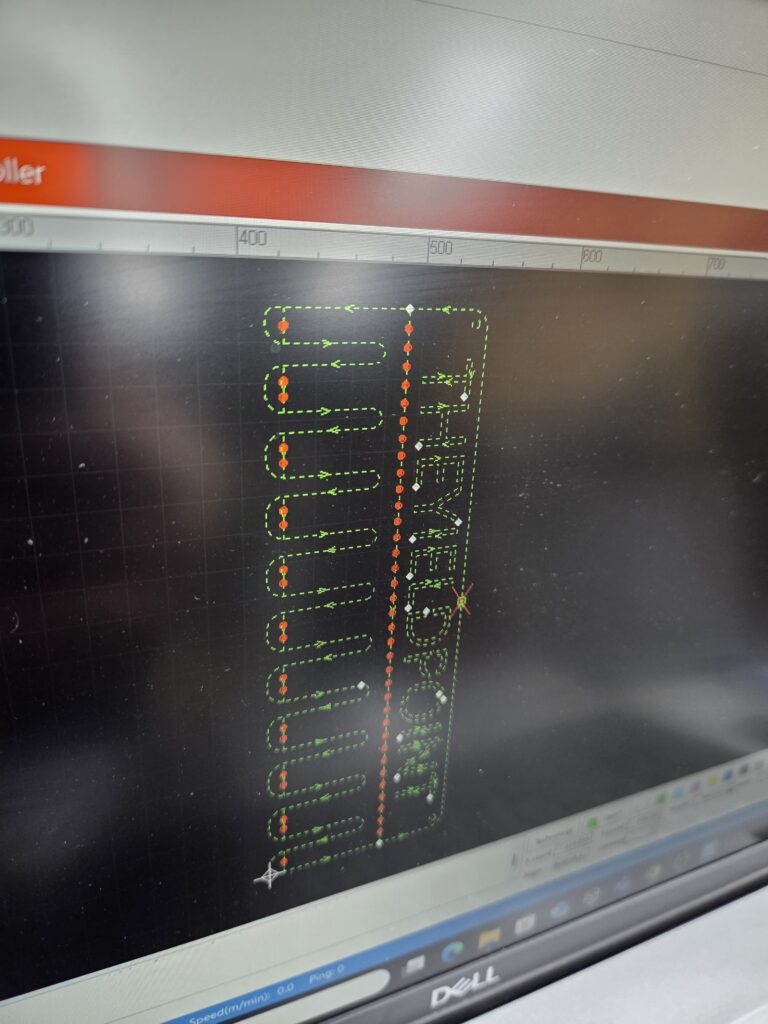 Gweike mLaser software showing a laser cutting toolpath with cooling point markers on the design