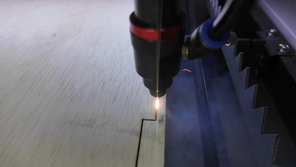 CO2 laser cutting a finger-jointed crate panel from 9 mm plywood